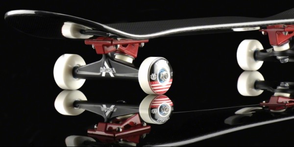 A shot of the wheels, trucks, and thickness of the board.