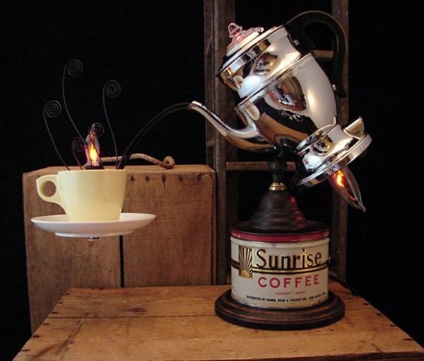 A lamp made from a coffee tin, teapot and teacup.